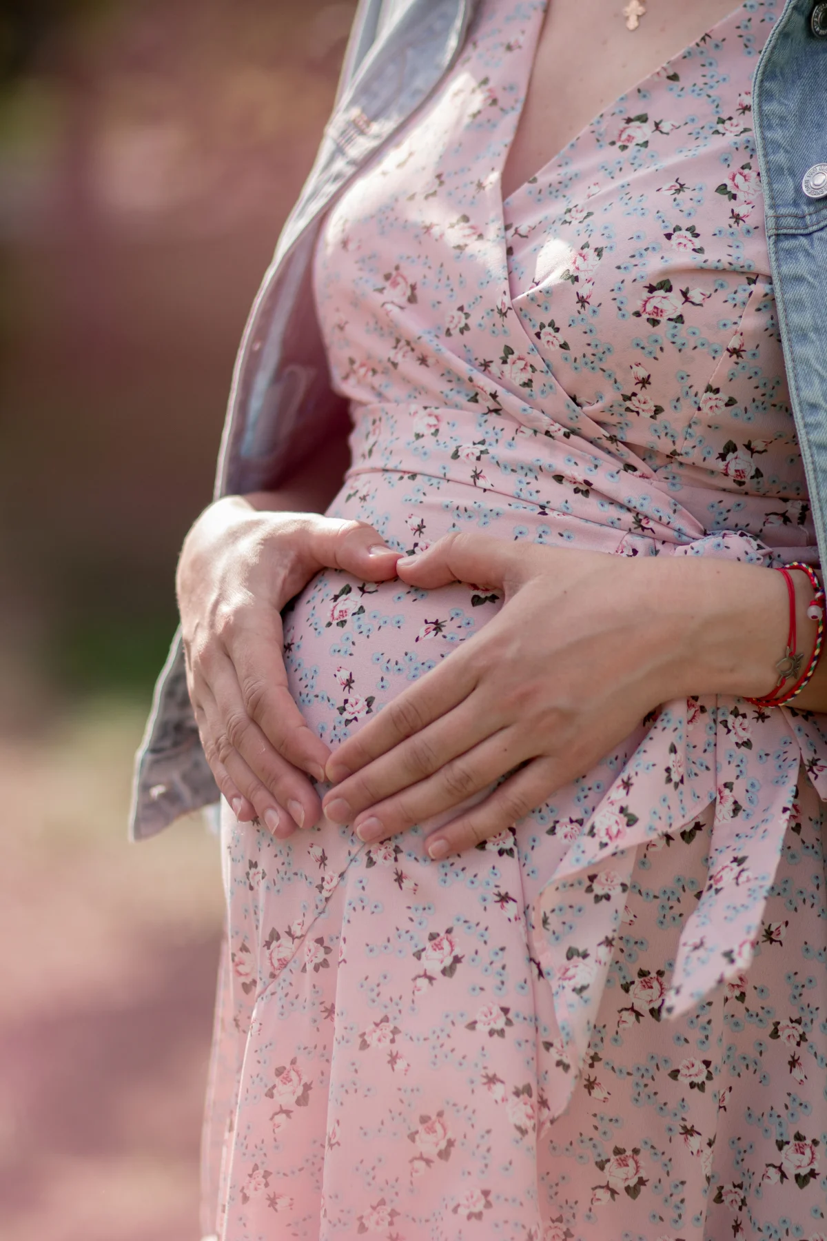 Pregnant person holding their belly