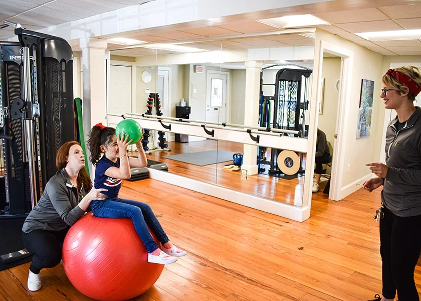Athletes completing outdoor running drills and sport-specific movement training